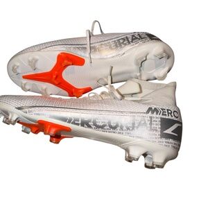 This is a pair of Nike Mercurial Superfly 6 Elite FG soccer cleats in white and